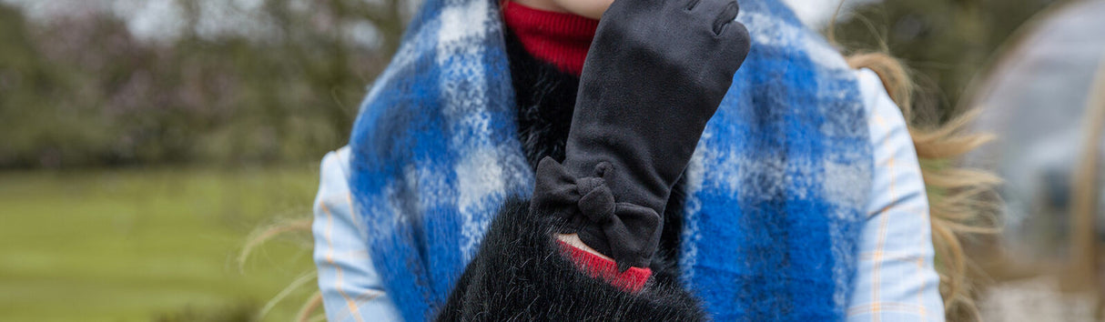 Dents Women’s Velour-Lined Faux Suede Gloves with Trim and Bow - Black